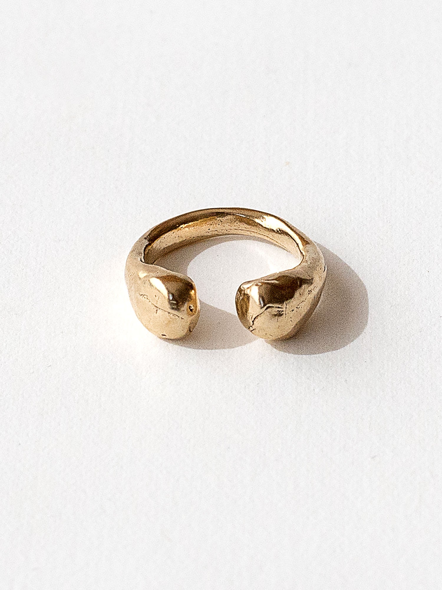 A handmade solid brass ring with an artistic front gap by Michelle Ross in Toronto, Canada