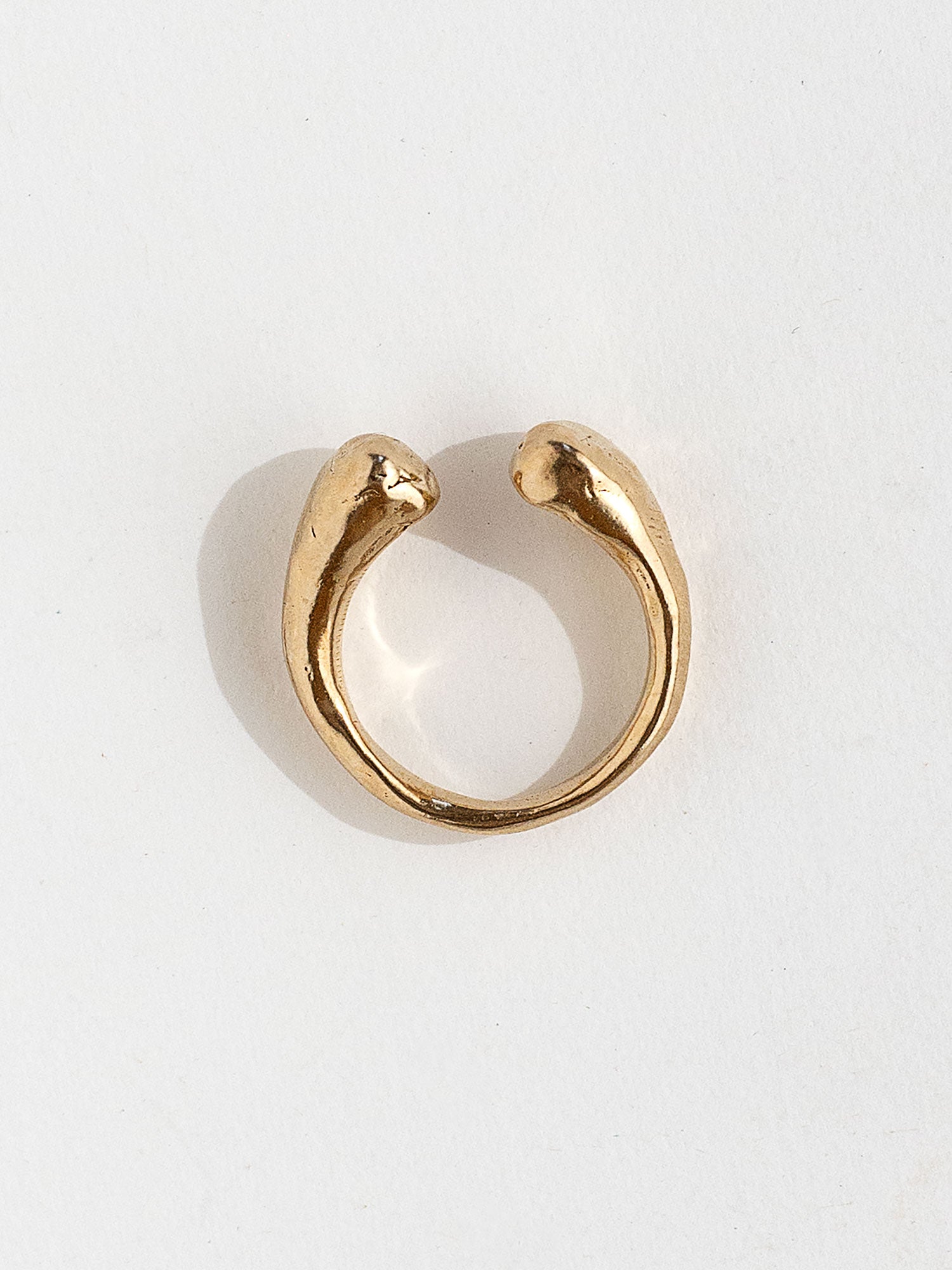 A handmade solid brass ring with an artistic front gap by Michelle Ross in Toronto, Canada