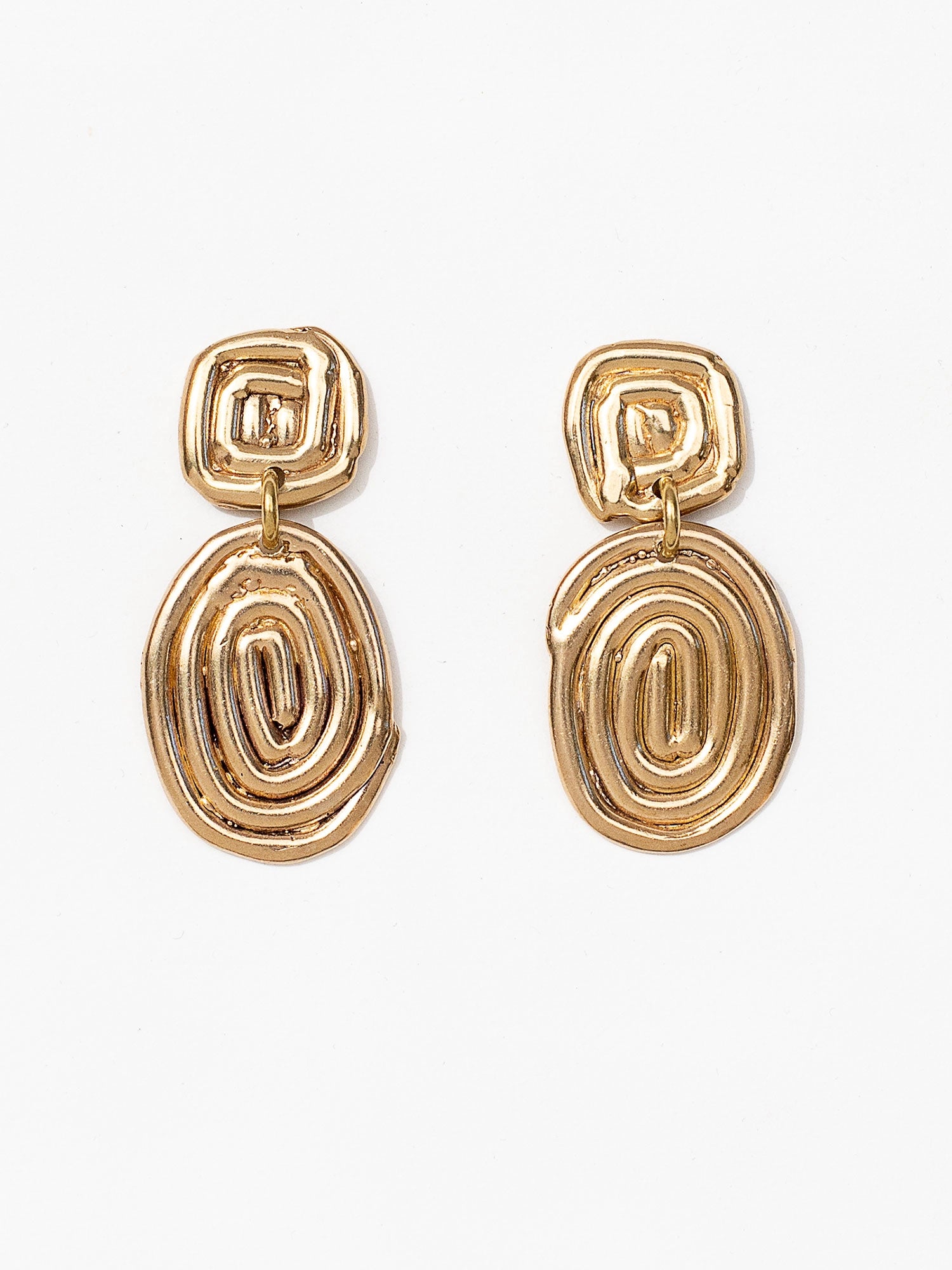 Two sets of brass spiral dangle drop earrings by Canadian jewellery designer Michelle Ross