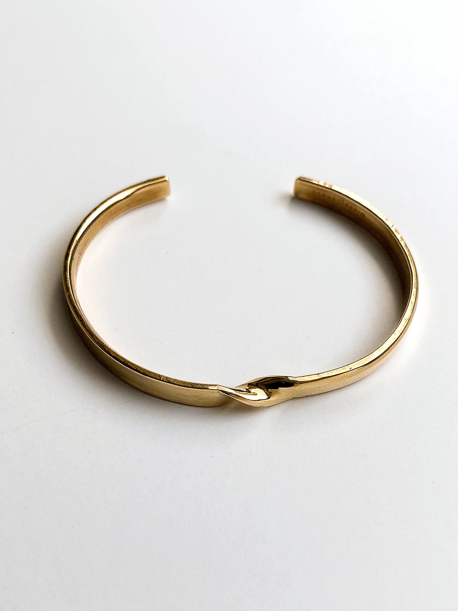 a brass cuff bracelet with twist detail handcrafted in Toronto by Michelle Ross