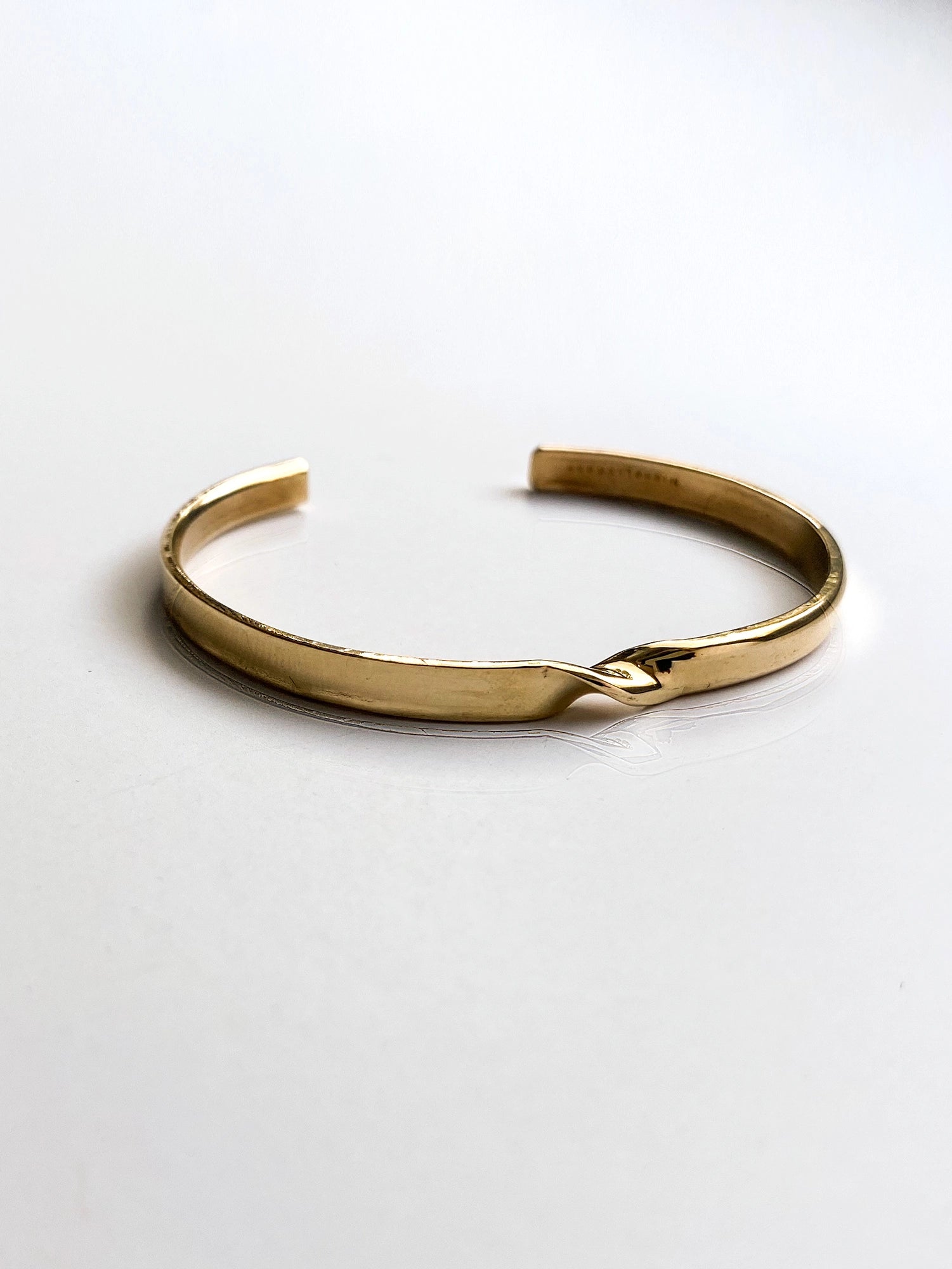 a brass cuff bracelet with twist detail handcrafted in Toronto by Michelle Ross