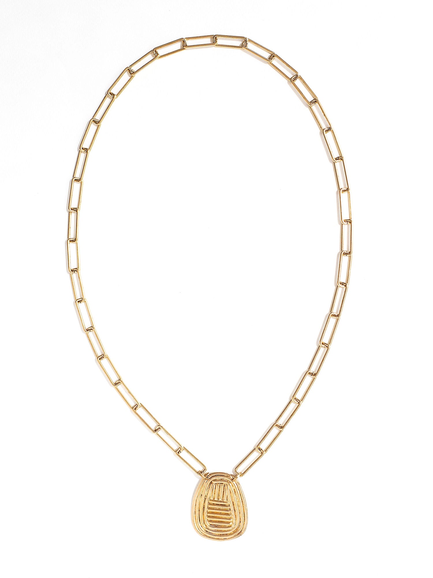 A brass chain link necklace with spiral circular pendant handcrafted by Canadian jewelry designer Michelle Ross