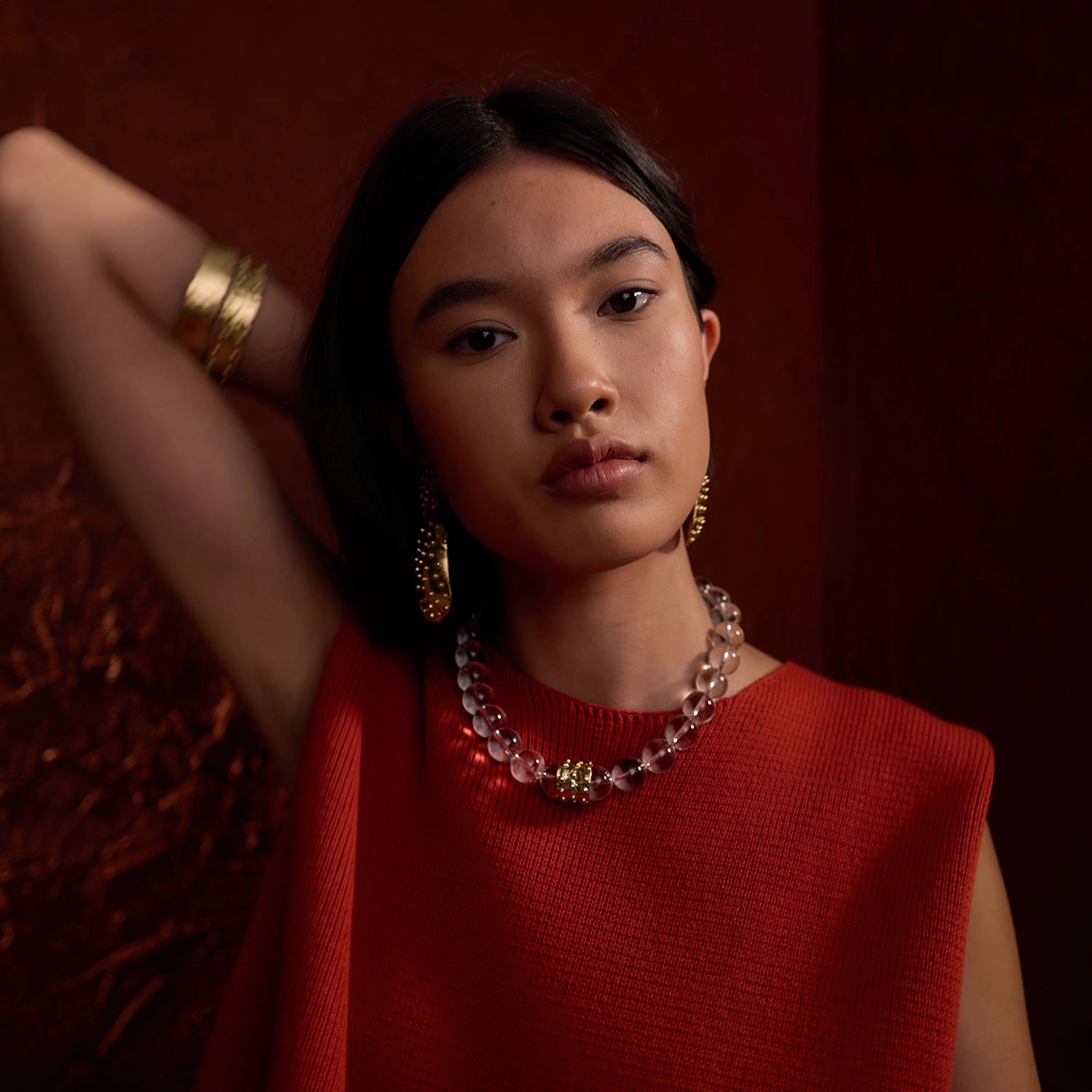 A woman wears Michelle Ross Contemporary Jewellery Earrings, Necklaces, Bracelets & Rings from Toronto Canada