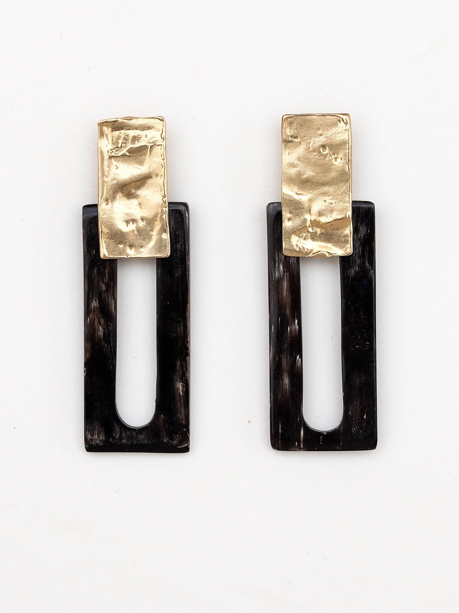 Pair of earrings with black horn rectangular design and brass details by Michelle Ross