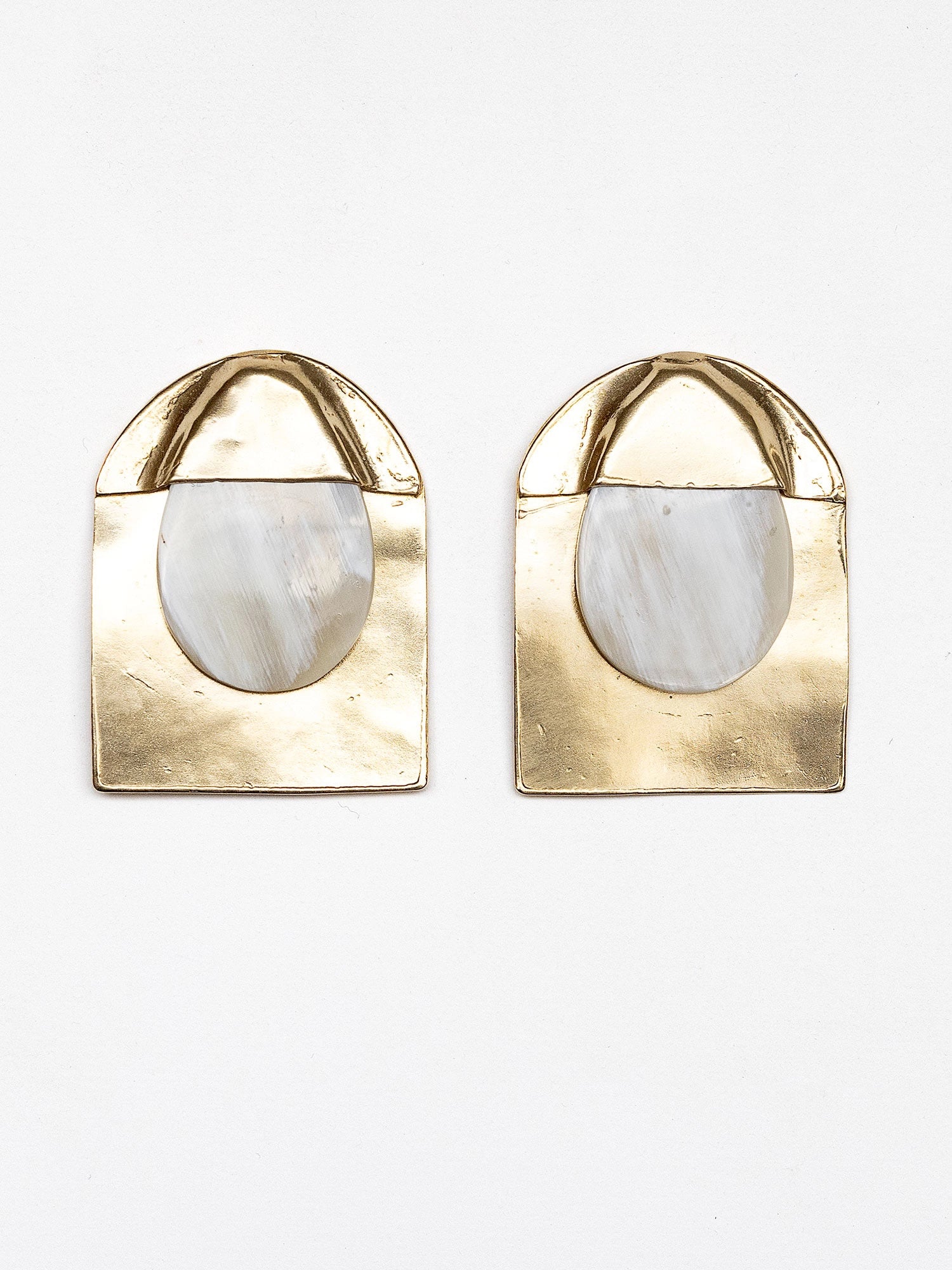 Pair of blonde horn and brass large statement stud earrings by Michelle Ross