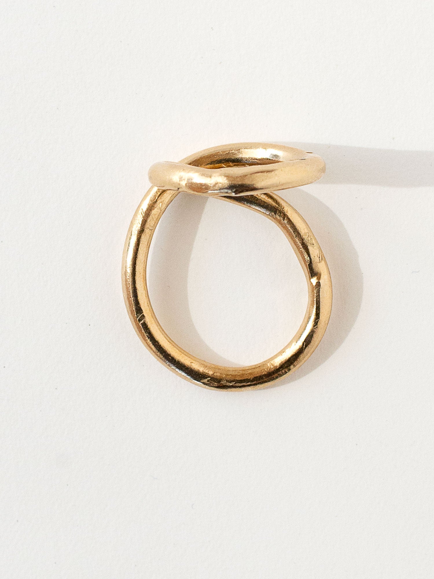 A handmade solid brass ring in an artistic twisting shape by Michele Ross in Toronto, Canada