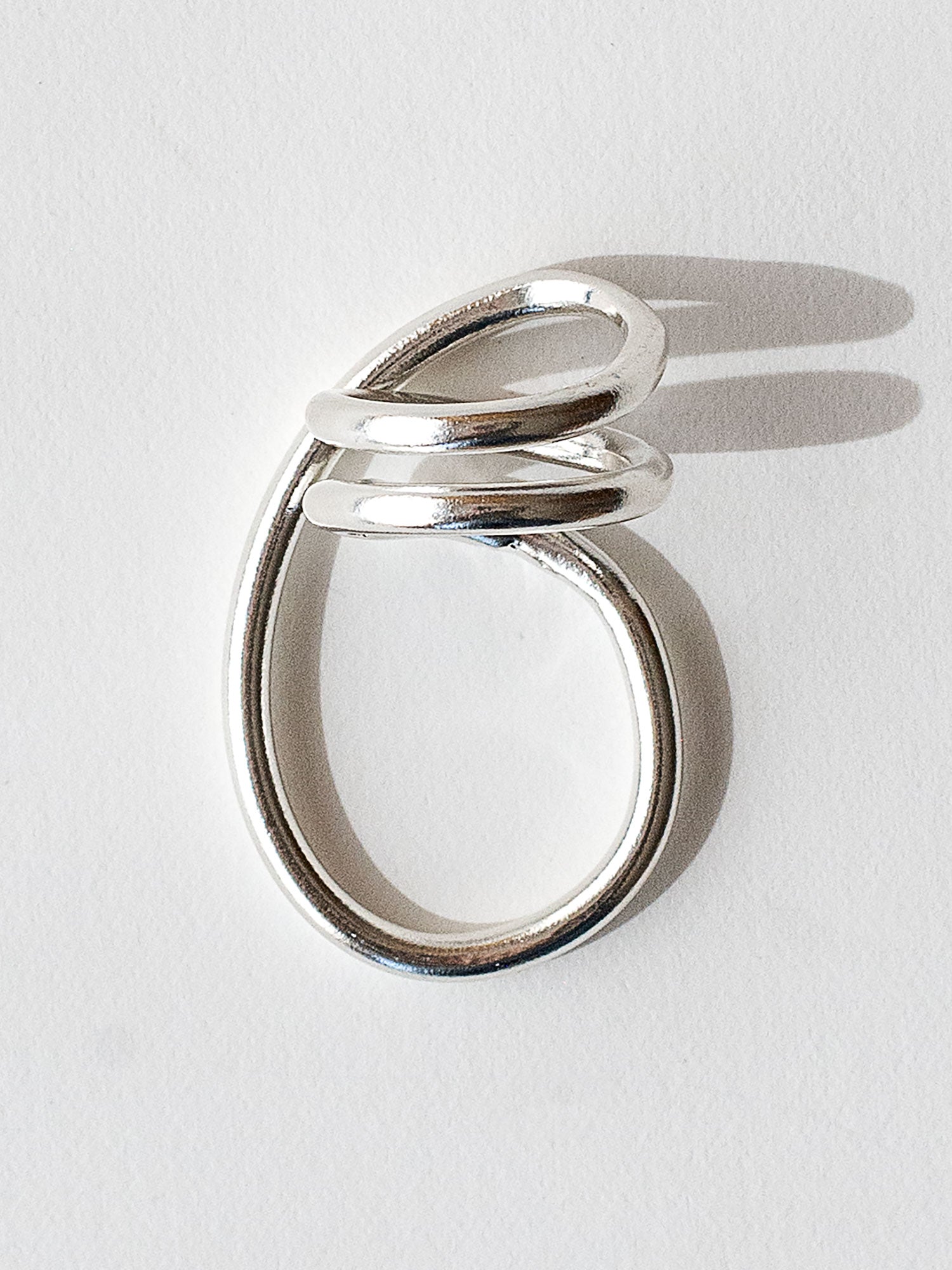 A handmade solid sterling silver ring in an artistic twisting shape by Michele Ross in Toronto, Canada