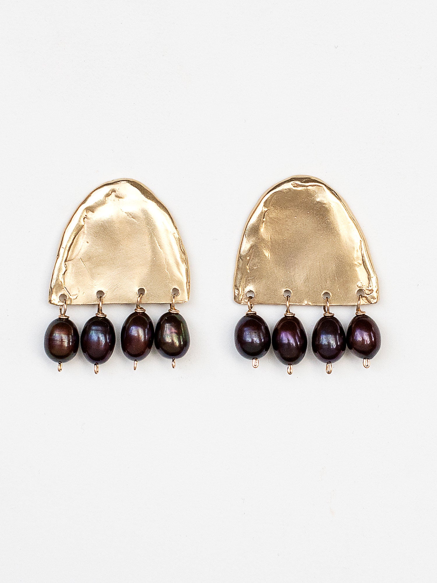A pair of large brass statement earrings with 4 espresso pearl beads dangling from each by Michelle Ross