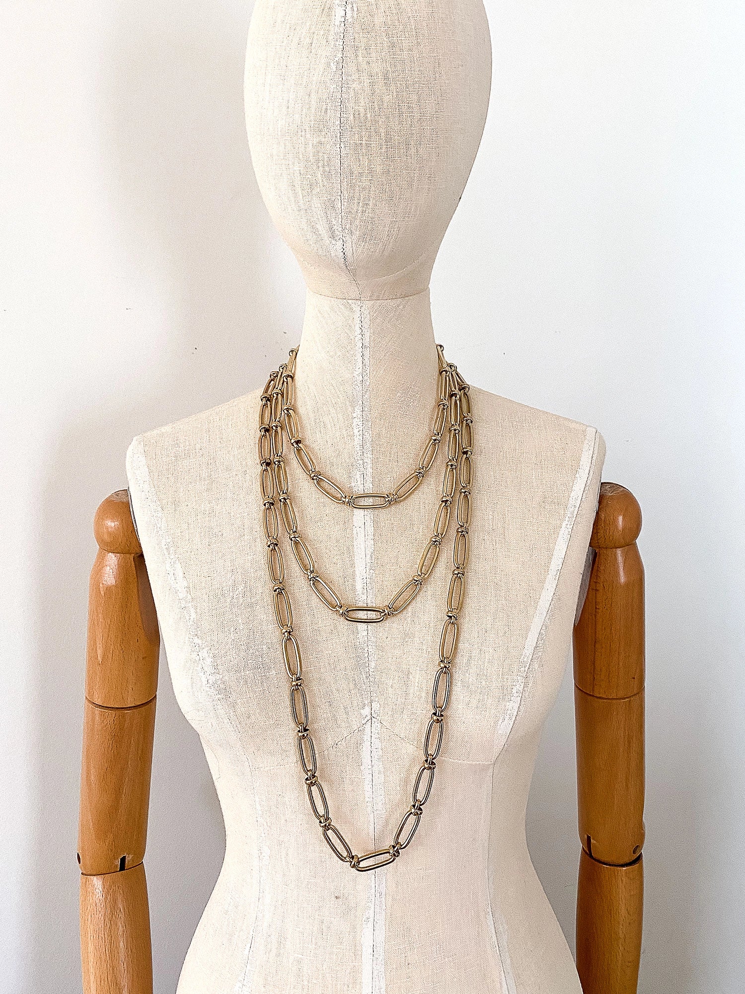3 different lengths of Thick Oval Brass Chain Necklaces on a Mannequin by Michelle Ross