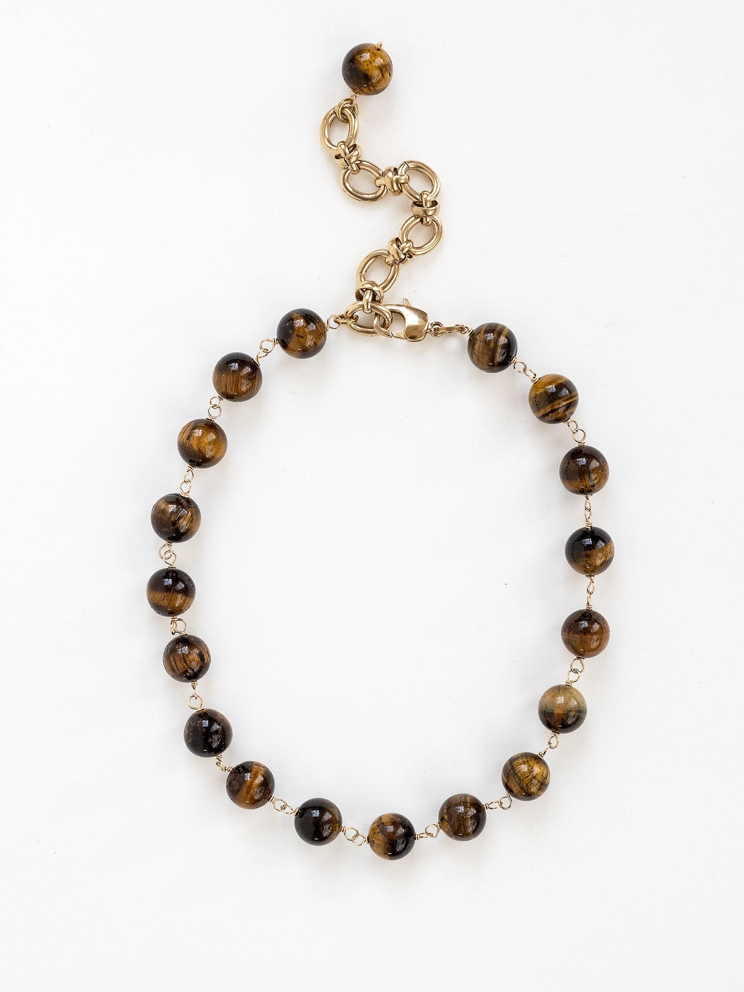 A brass and beaded chain necklace with tigers eye by Michelle Ross
