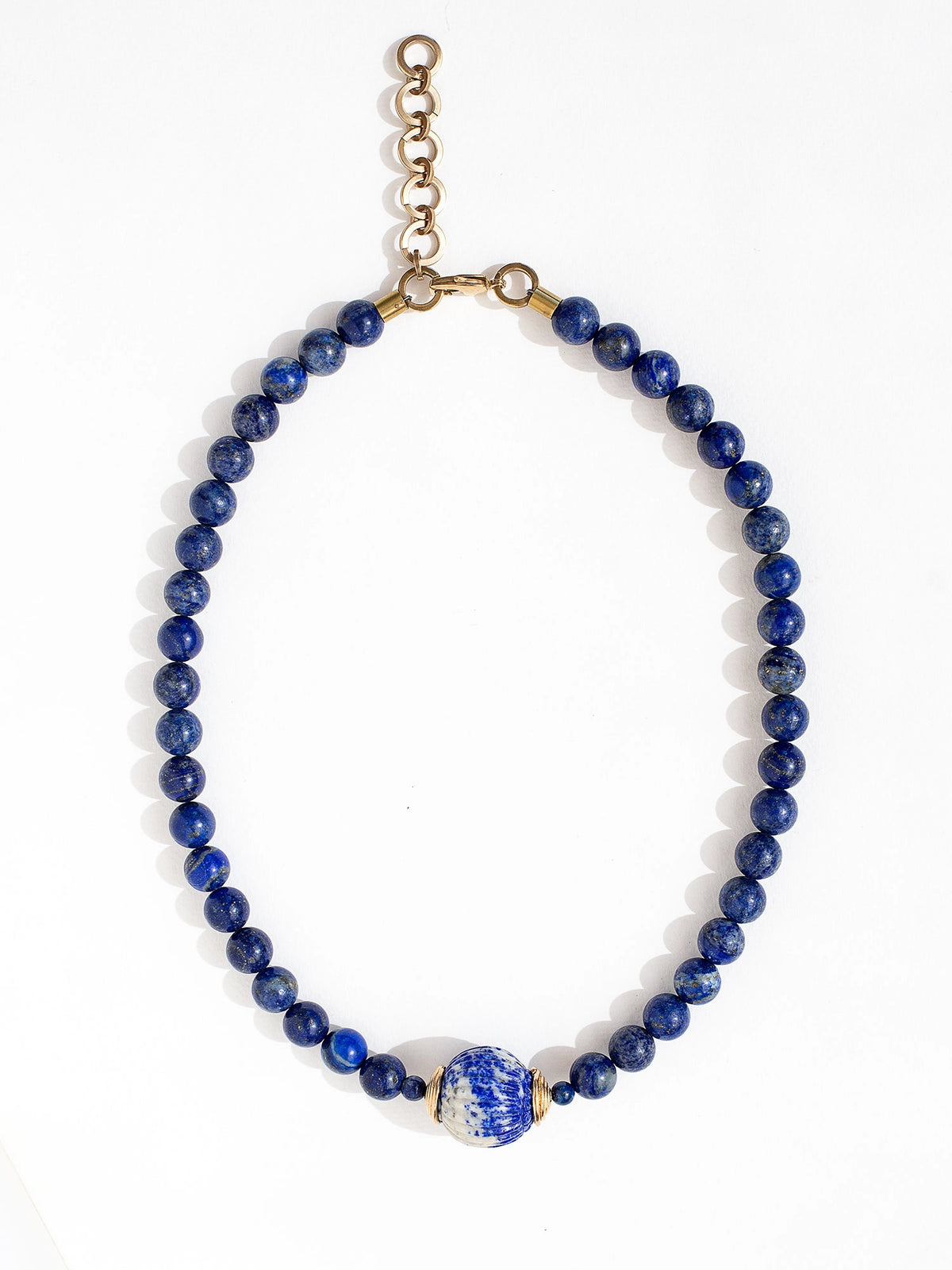 Three beaded lapis lazuli strand necklaces with large lapis lazuli and brass circular pendant by Canadian jewelry designer Michelle Ross