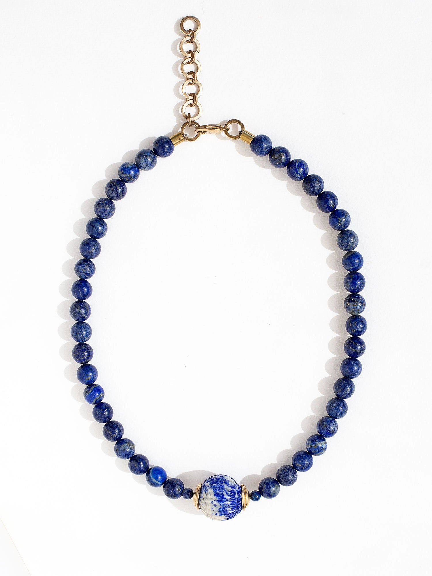 Three beaded lapis lazuli strand necklaces with large lapis lazuli and brass circular pendant by Canadian jewelry designer Michelle Ross