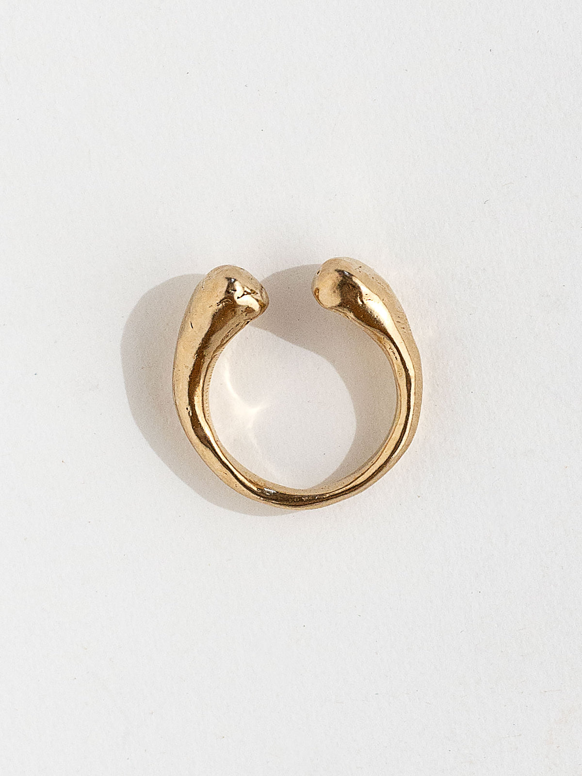 A handmade solid brass ring with an artistic front gap by Michelle Ross in Toronto, Canada