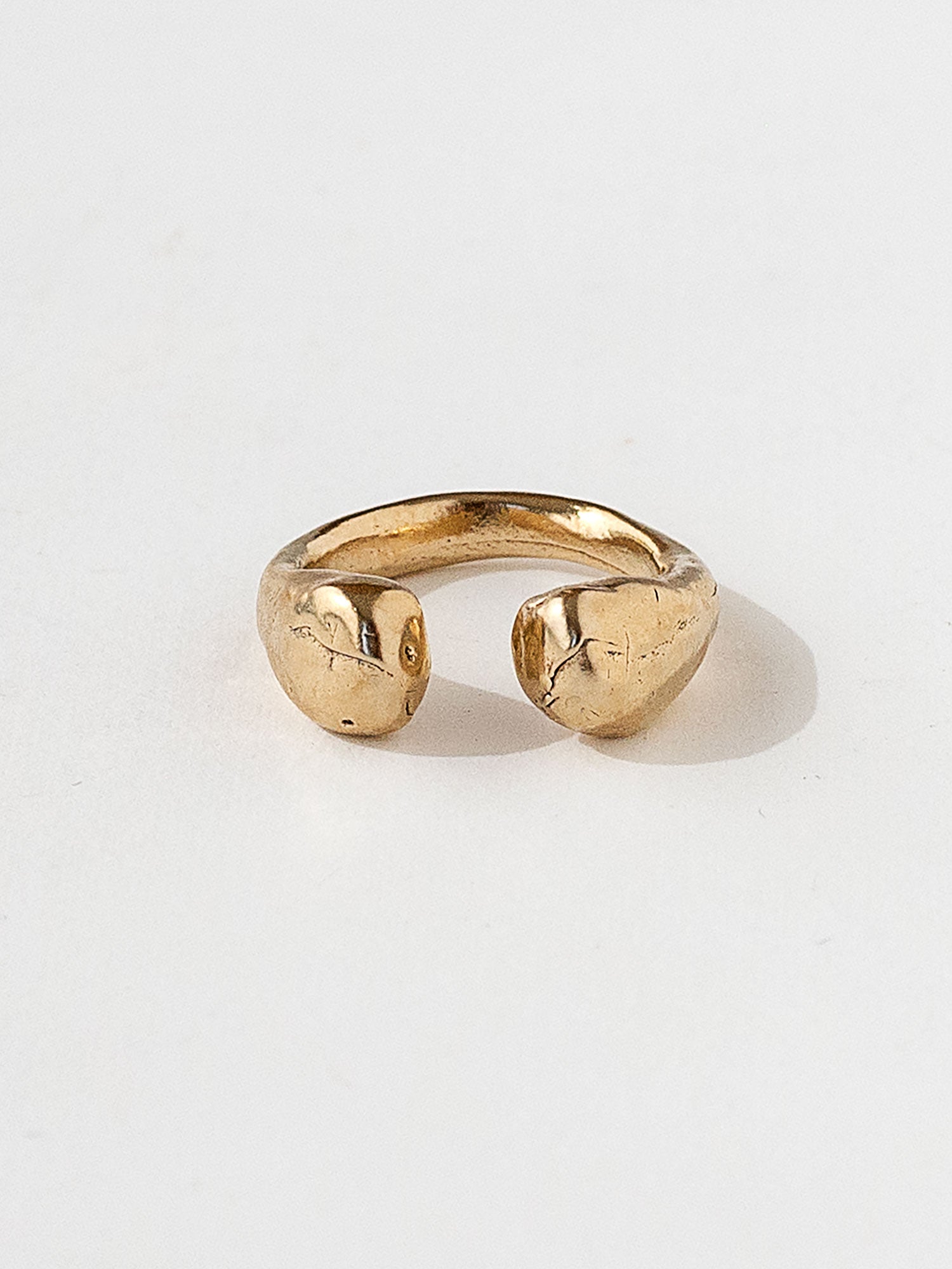A handmade solid brass ring with an artistic front gap by Michelle Ross in Toronto, Canada