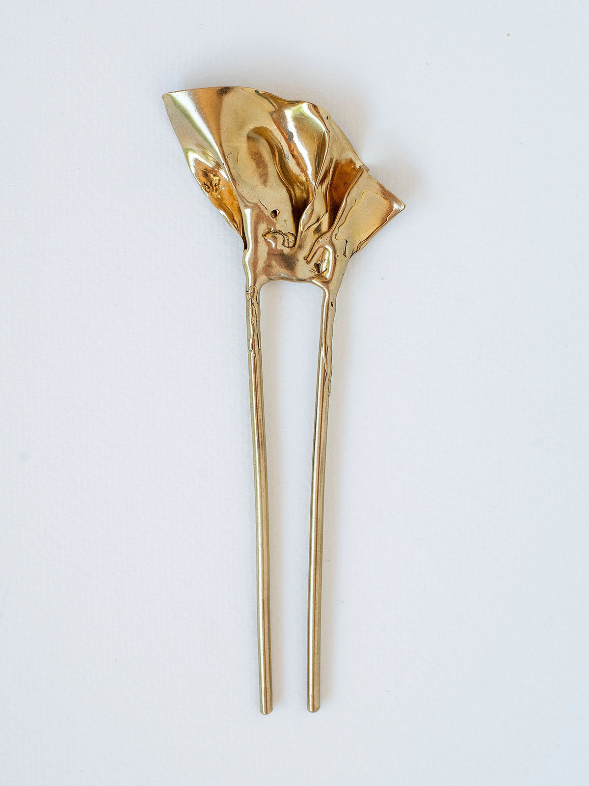 A large brass ruffle brass hairpin by Michelle Ross