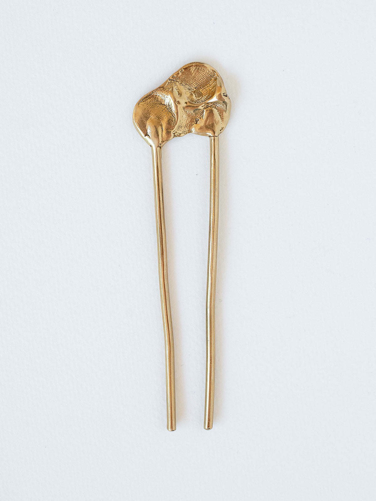 A large brass hairpin by Michelle Ross
