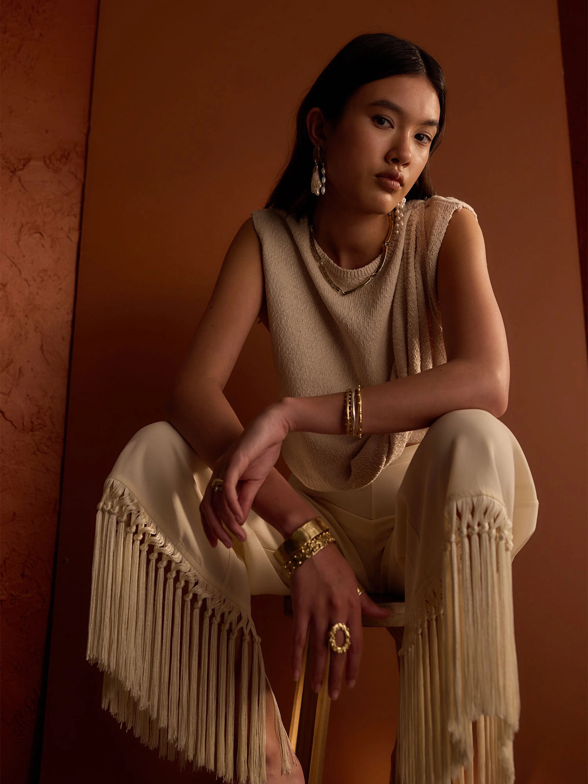 A woman wears Michelle Ross Pearl Earrings