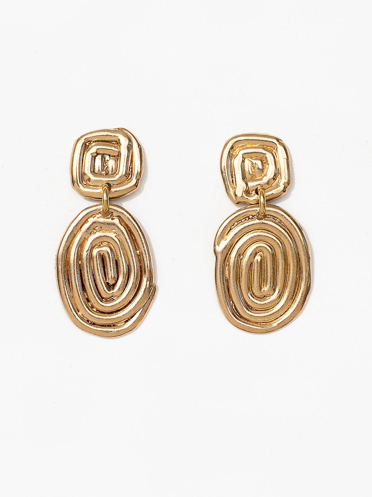Two sets of brass spiral dangle drop earrings by Canadian jewellery designer Michelle Ross 