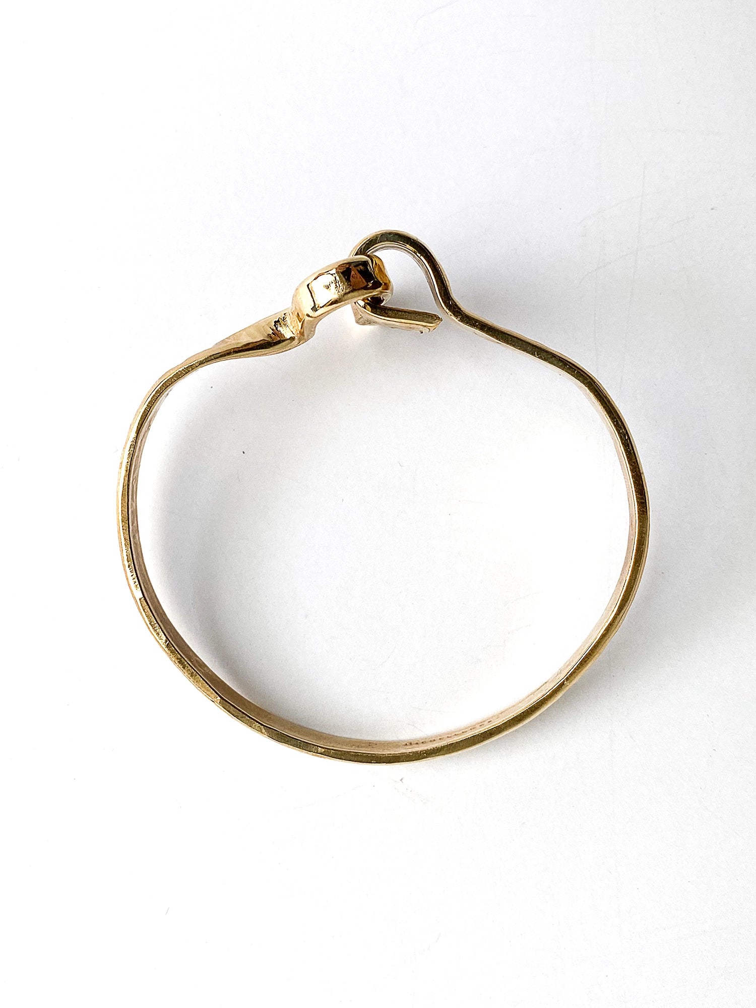 a hammered brass bangle bracelet handcrafted in Toronto by Michelle Ross