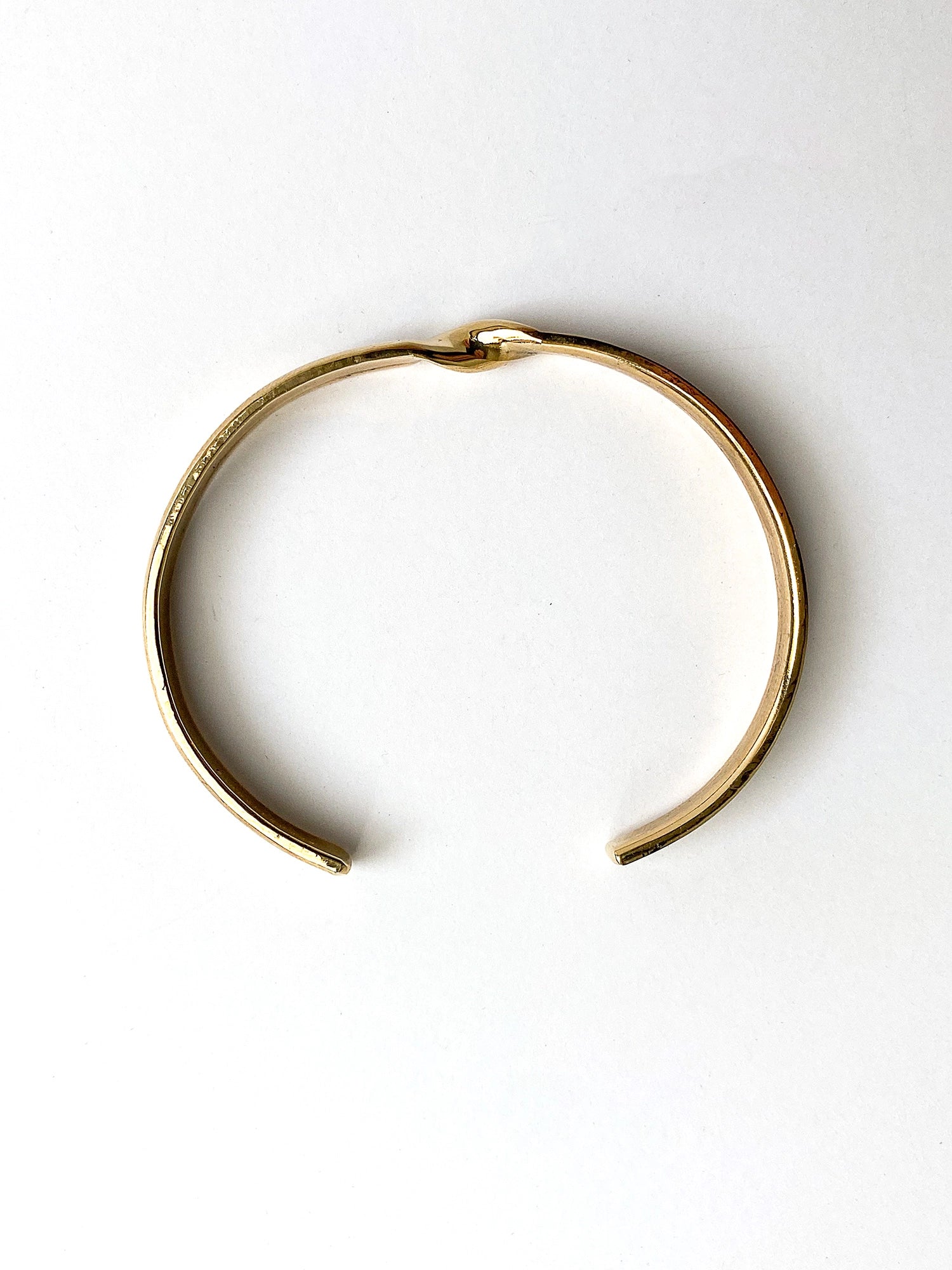 a brass cuff bracelet with twist detail handcrafted in Toronto by Michelle Ross