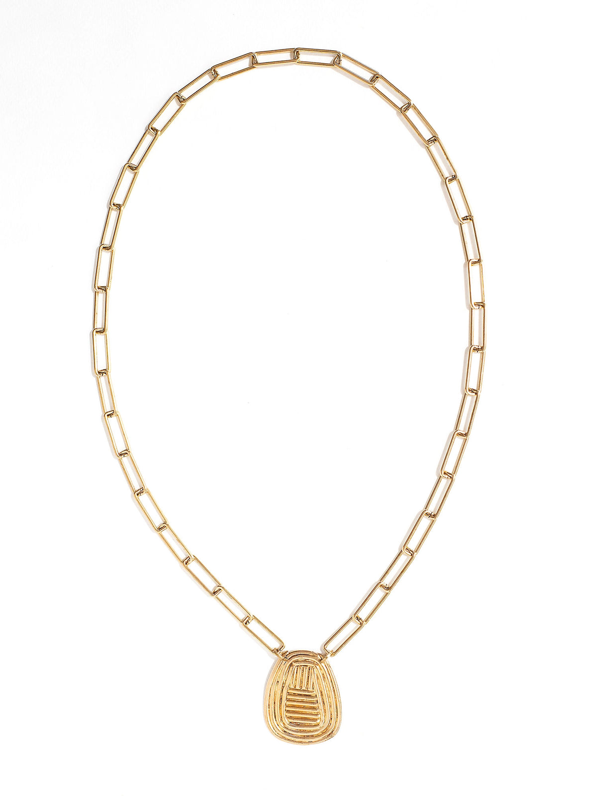 A brass chain link necklace with spiral circular pendant handcrafted by Canadian jewelry designer Michelle Ross