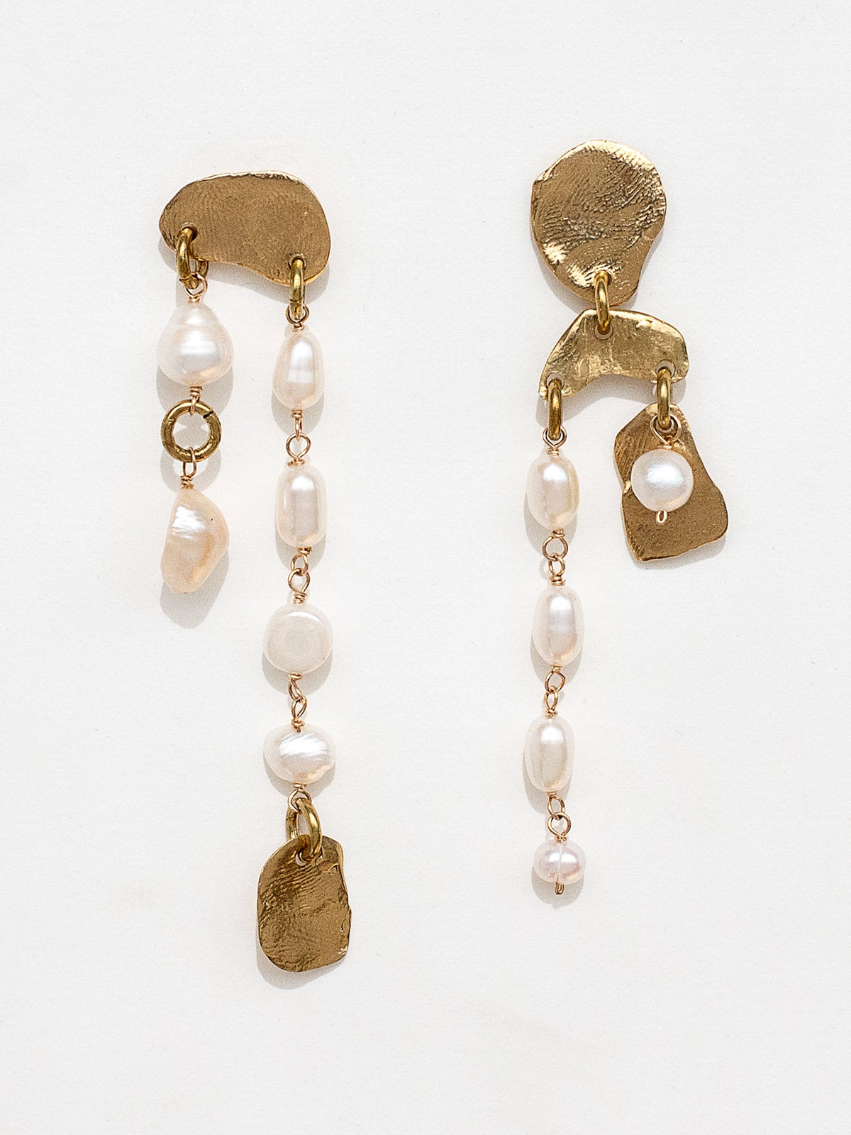 Gold brass and pearl asymmetrical chandelier earrings by Canadian designer Michelle Ross