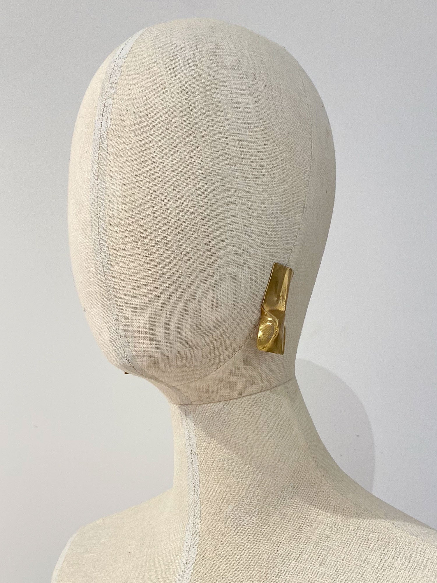 pair of gold brass statement stud earrings by Michelle Ross
