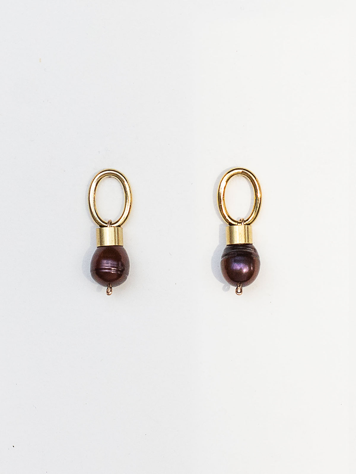 pair of brass earrings with espresso brown pearl drops