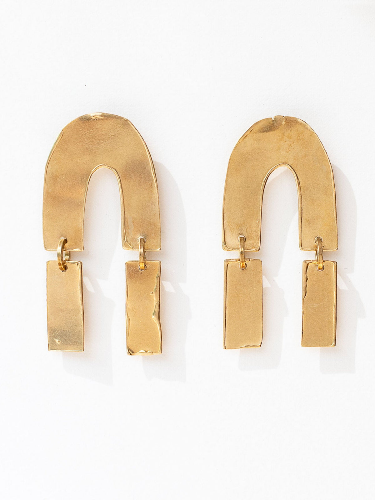 pair of gold extra large brass modern statement earrings by Michelle Ross