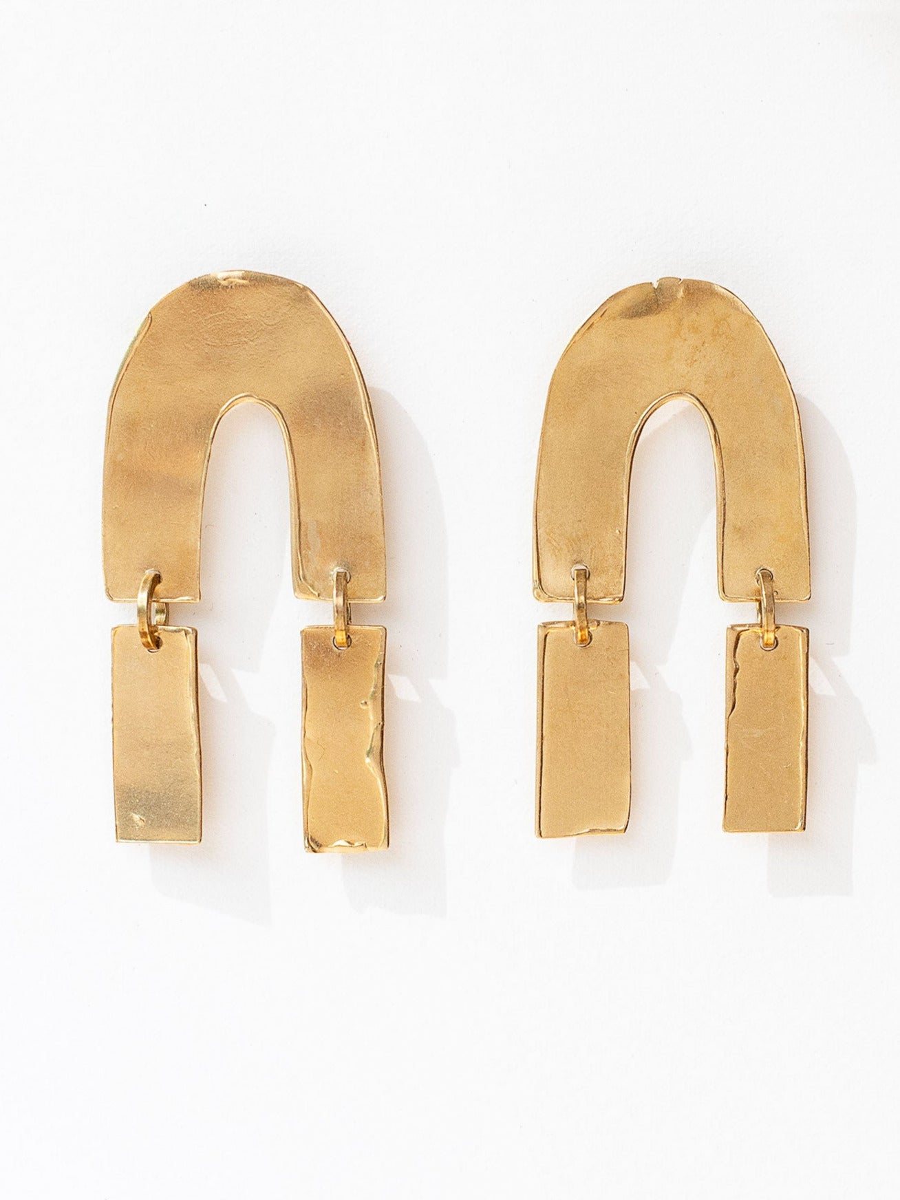 pair of gold extra large brass modern statement earrings by Michelle Ross