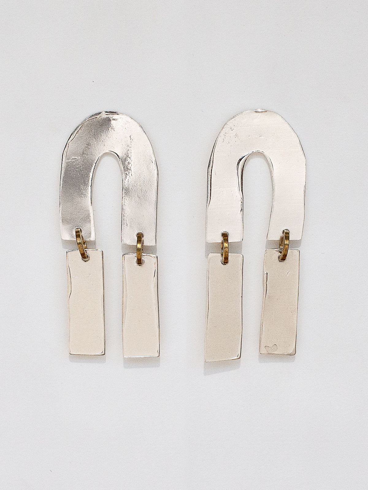Pair of silver statement earrings by Michelle Ross