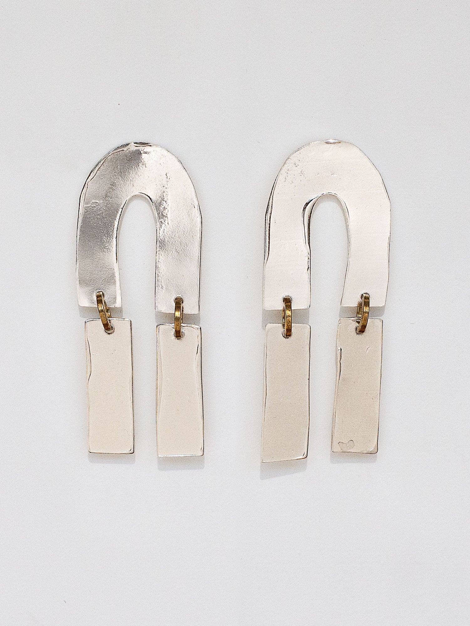 Pair of silver statement earrings by Michelle Ross