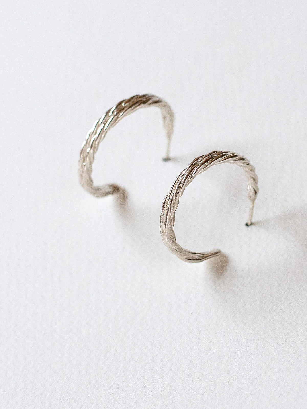 Klaire Twisted Silver Hoop Earrings Michelle Ross