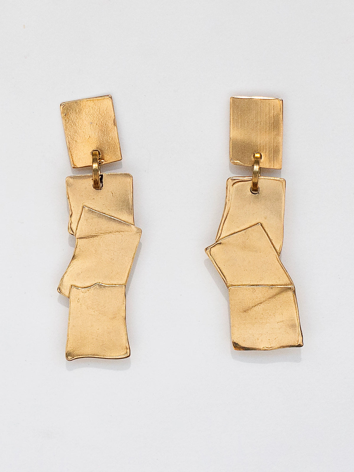 Gold geometric brass statement earrings by Michelle Ross