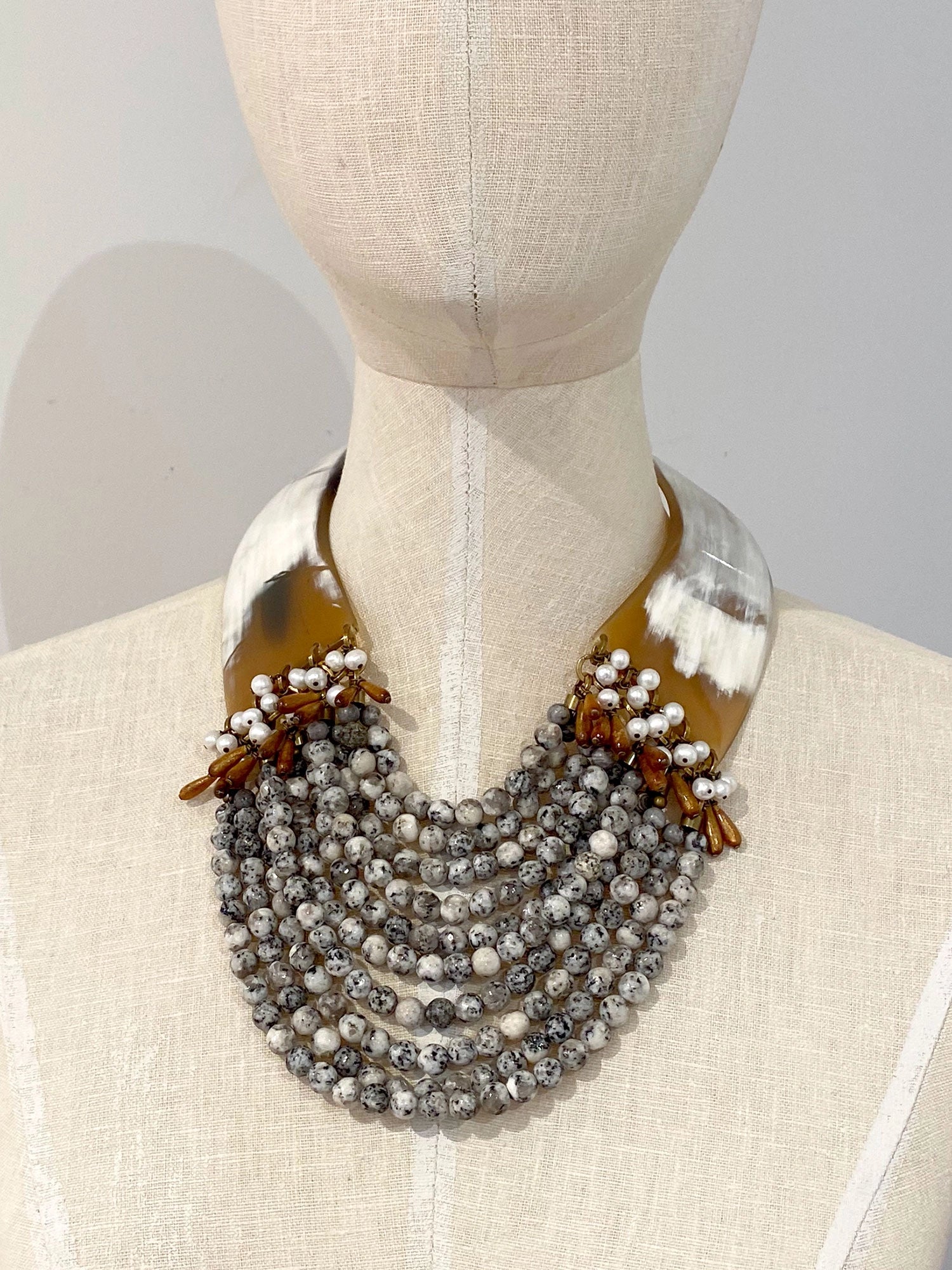 Necklace with layered beads of sesame jasper, sea bamboo & fresh water pearl with and horn collar necklace by Michelle Ross