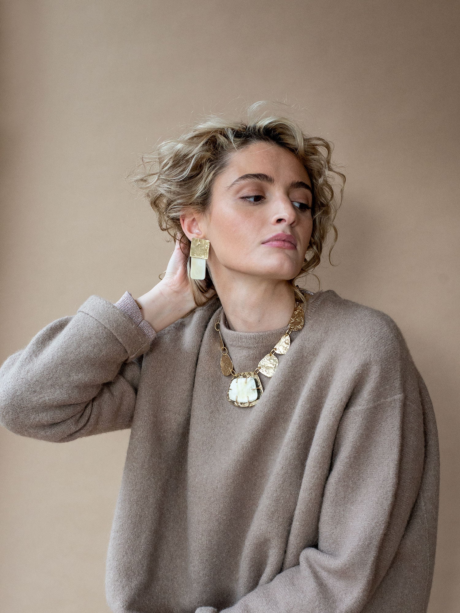 Brass Statement Necklace with large central horn pendant and brass hand formed discs by Michelle Ross