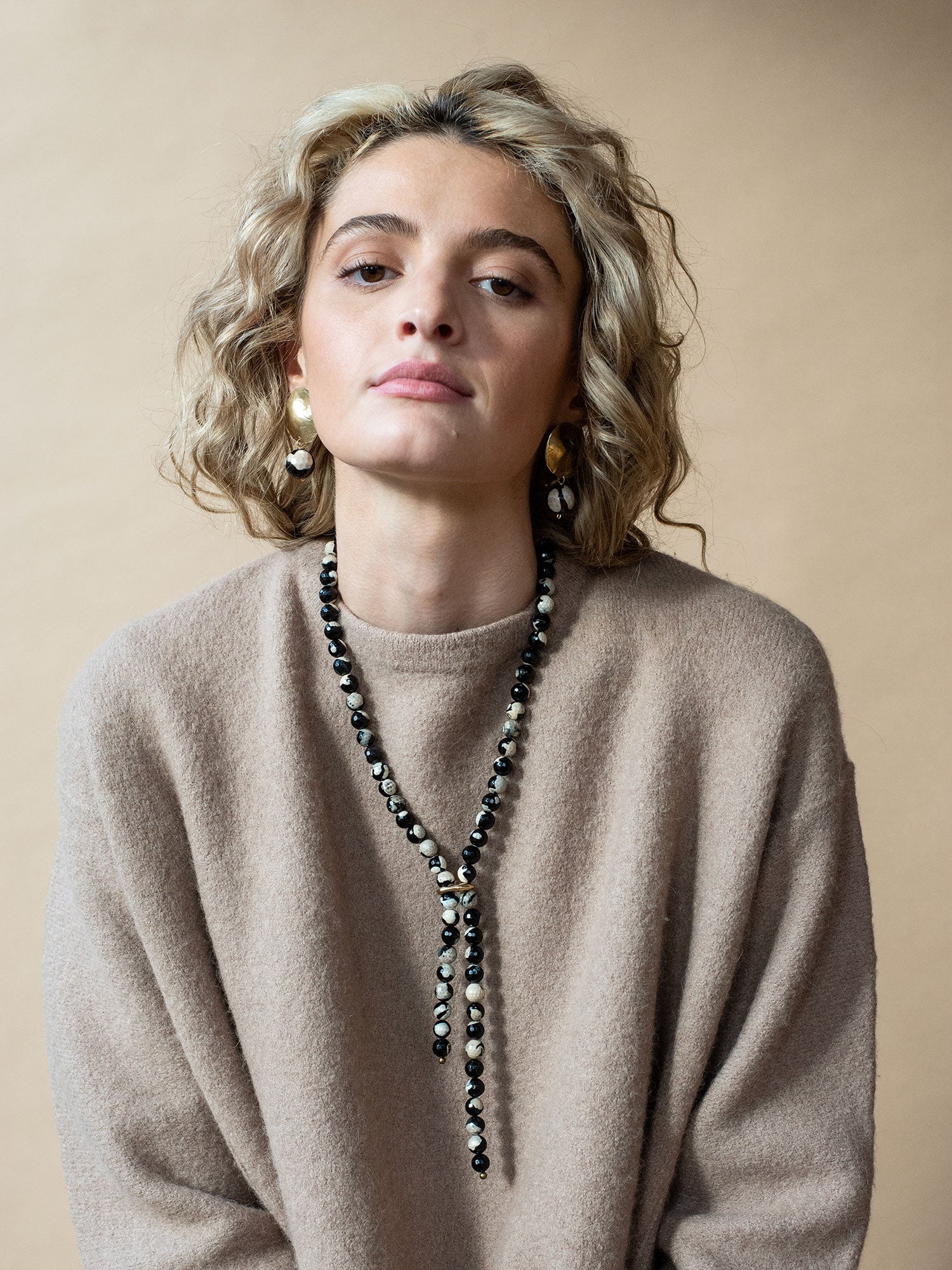 statement brass earrings with a marbled agate bead drop by Michlle Ross