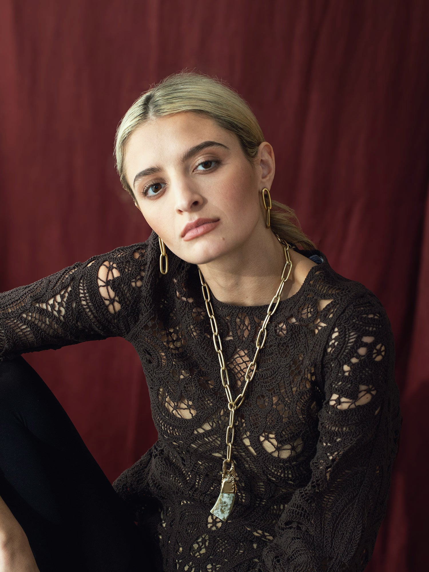 Brass chain link lariat necklace with a large camel horn pendant by Michelle Ross