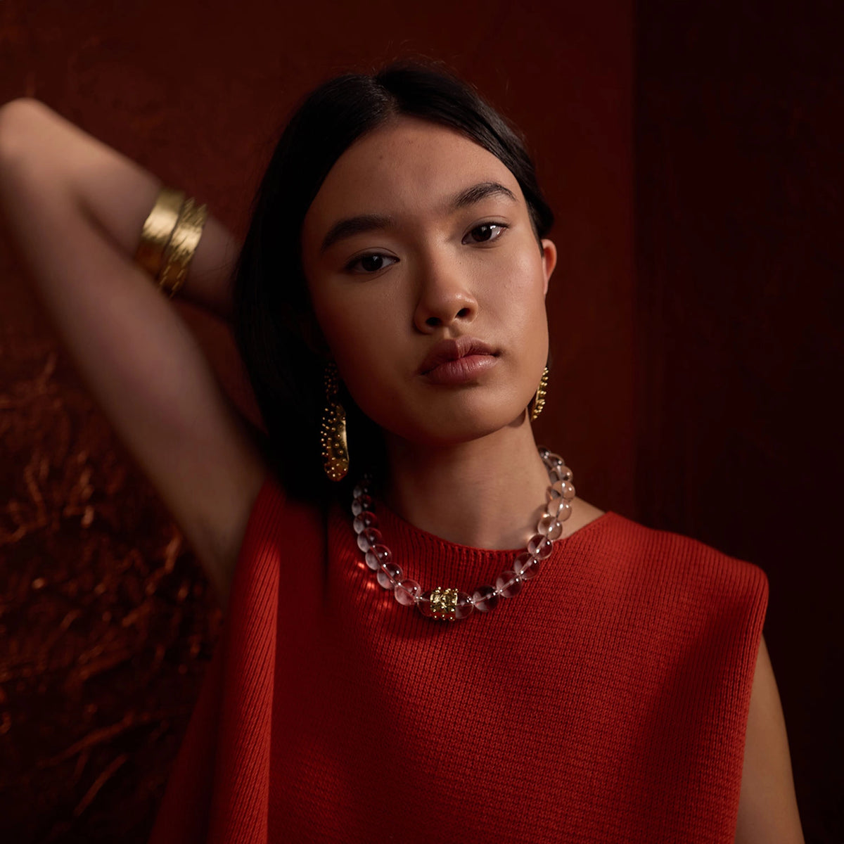 A woman wears Michelle Ross Contemporary Jewellery Earrings, Necklaces, Bracelets &amp; Rings from Toronto Canada