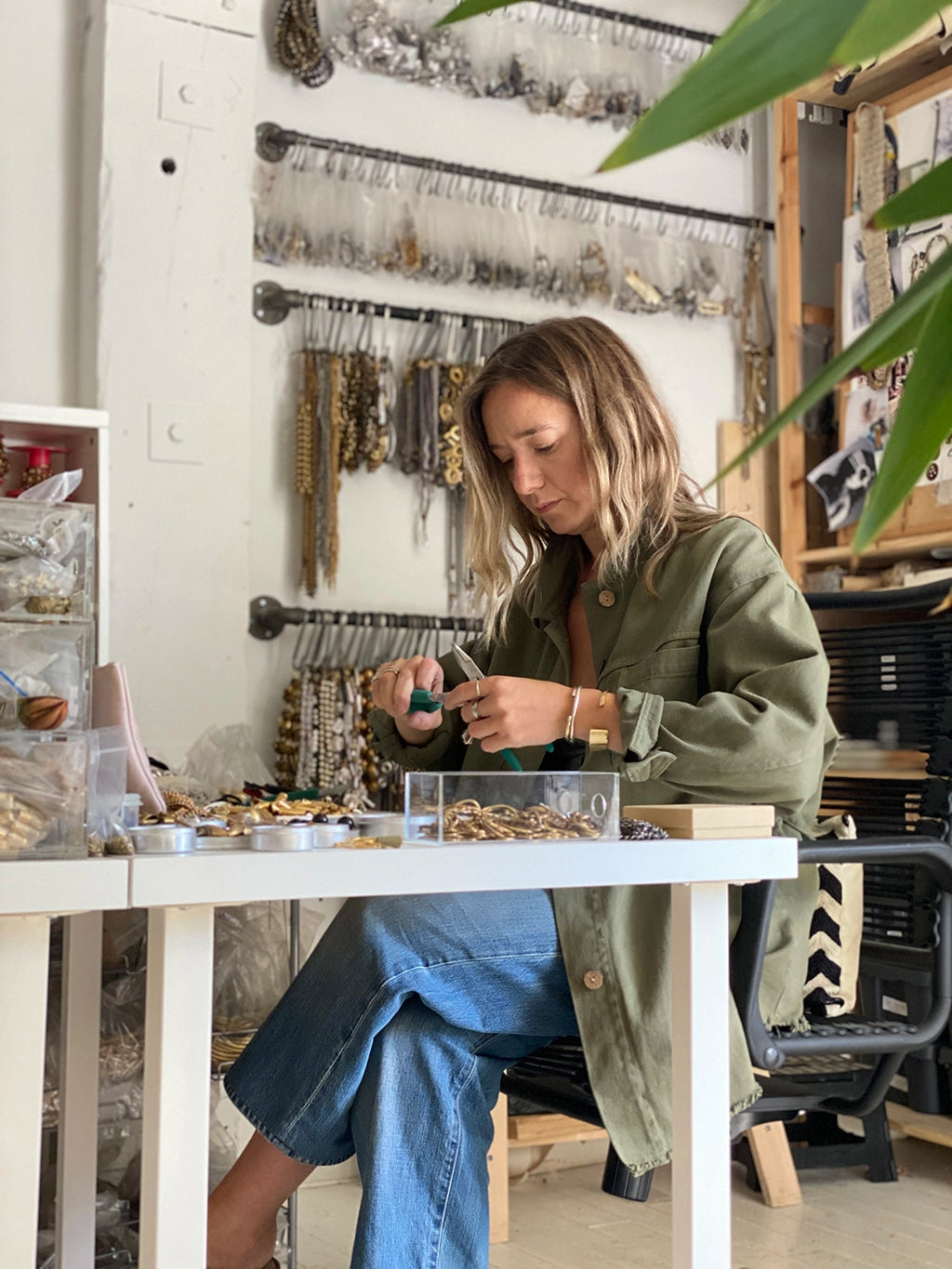 Michelle Ross, the jewellery designer creating necklaces and earrings in her workshop