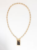 A brass rectangular chain link necklace with statement brass and horn rectangular pendant by Michelle Ross