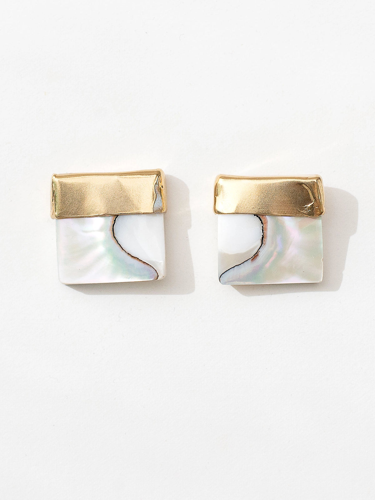 A pair of square shell mother of pearl and brass statement earrings by contemporary designer Michelle Ross