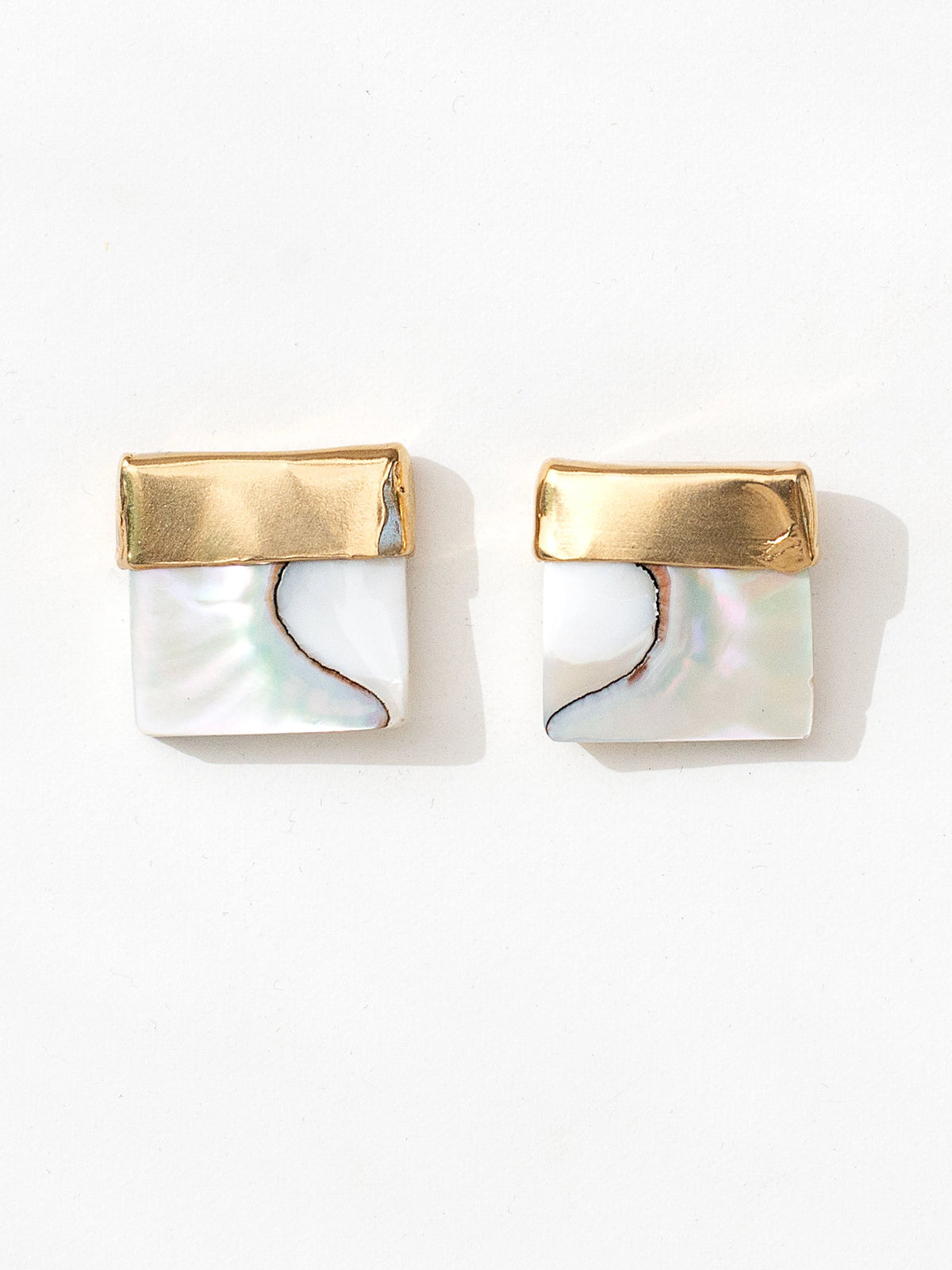 A pair of square shell mother of pearl and brass statement earrings by contemporary designer Michelle Ross