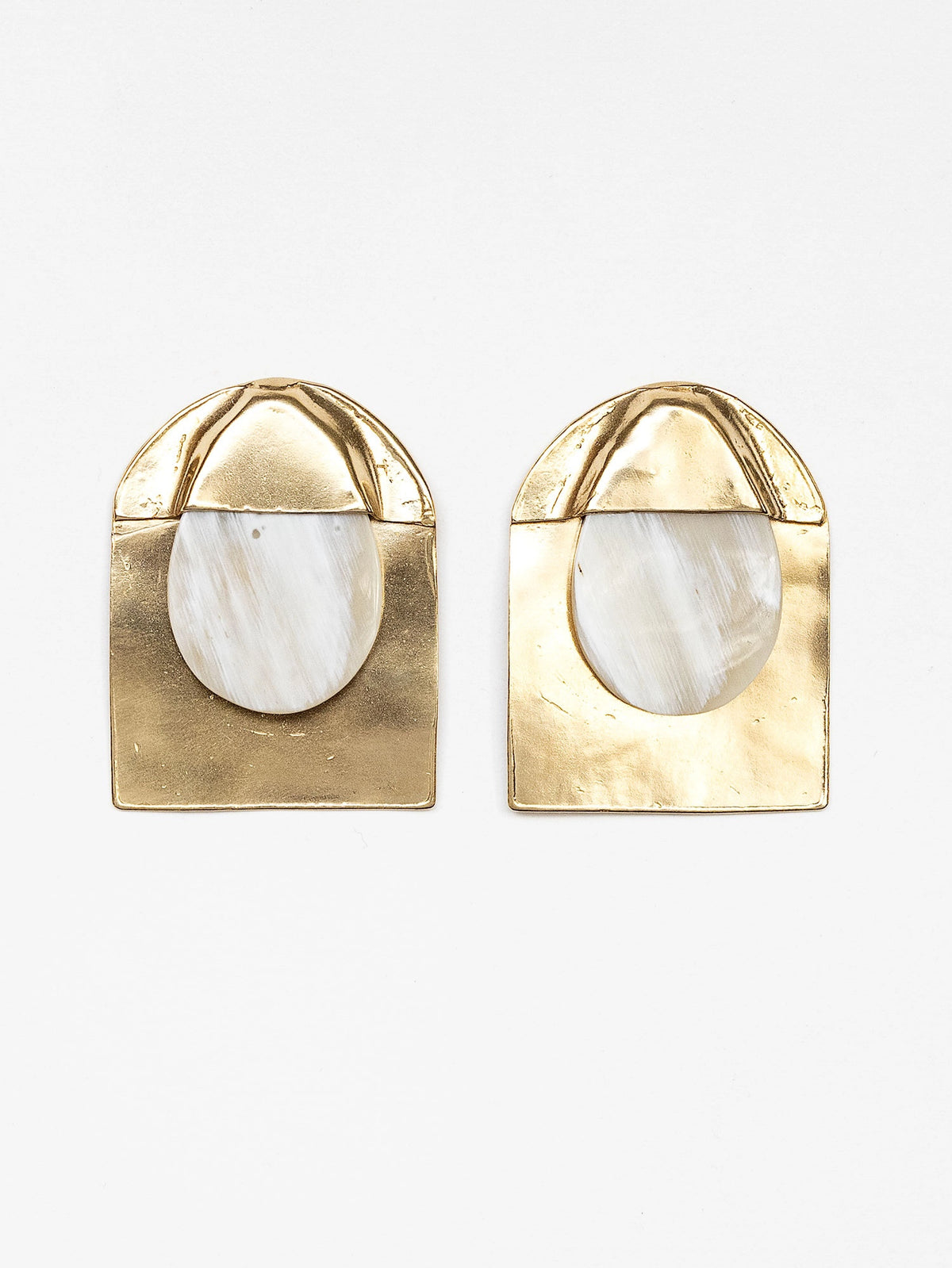 Pair of blonde horn and brass large statement stud earrings by Michelle Ross