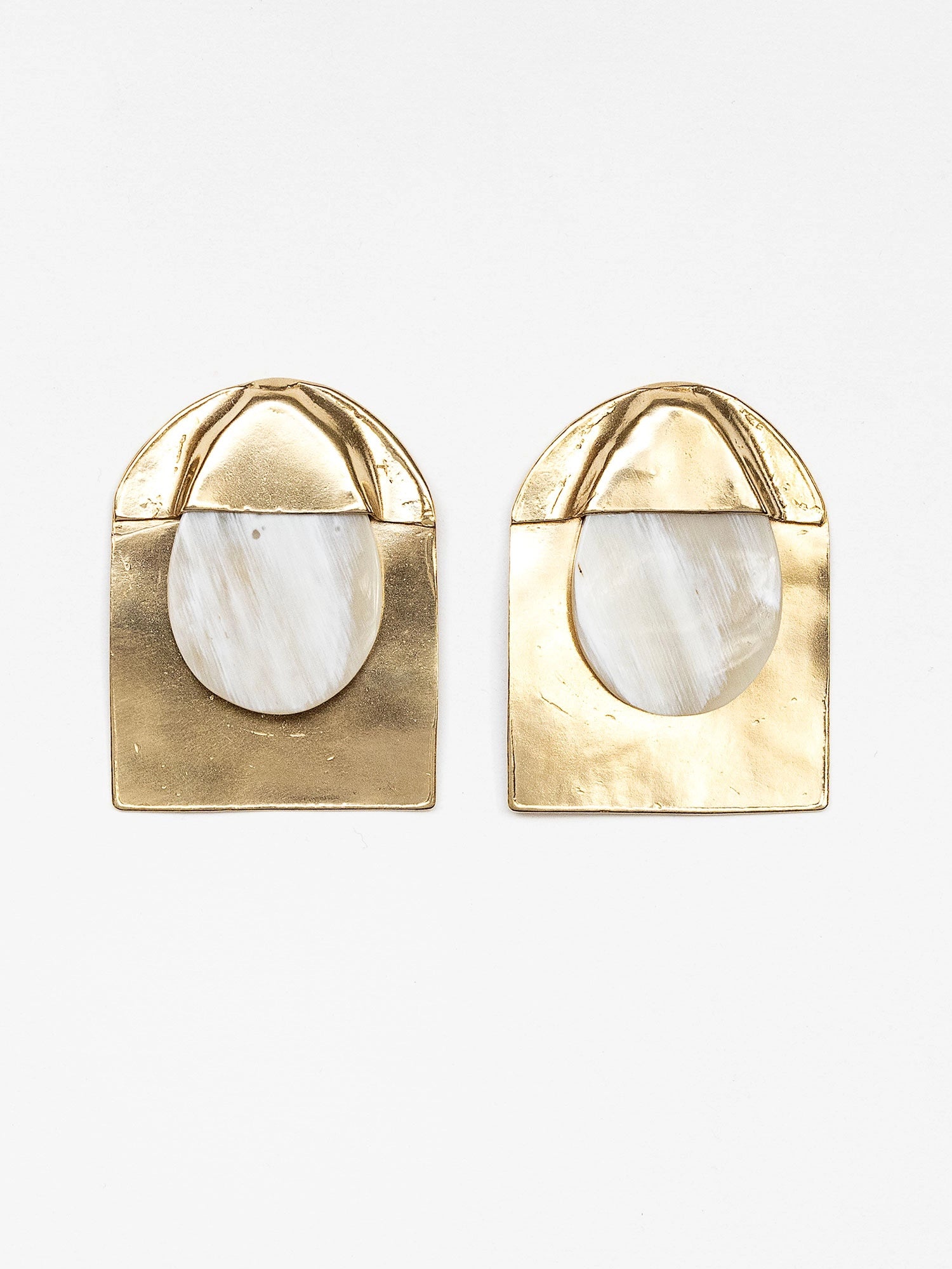 Pair of blonde horn and brass large statement stud earrings by Michelle Ross