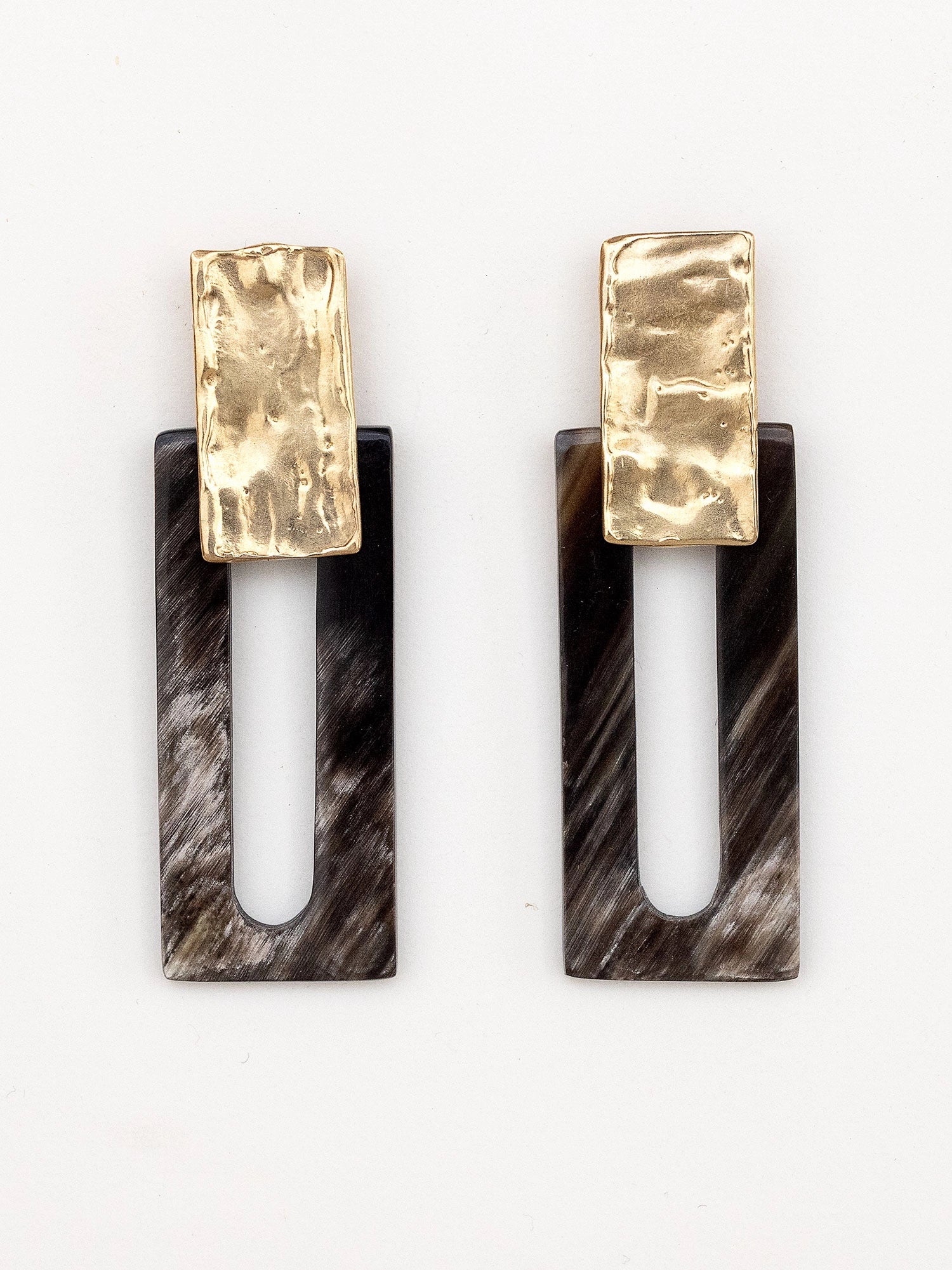 Pair of earrings with marbled black horn rectangular design and brass details by Michelle Ross