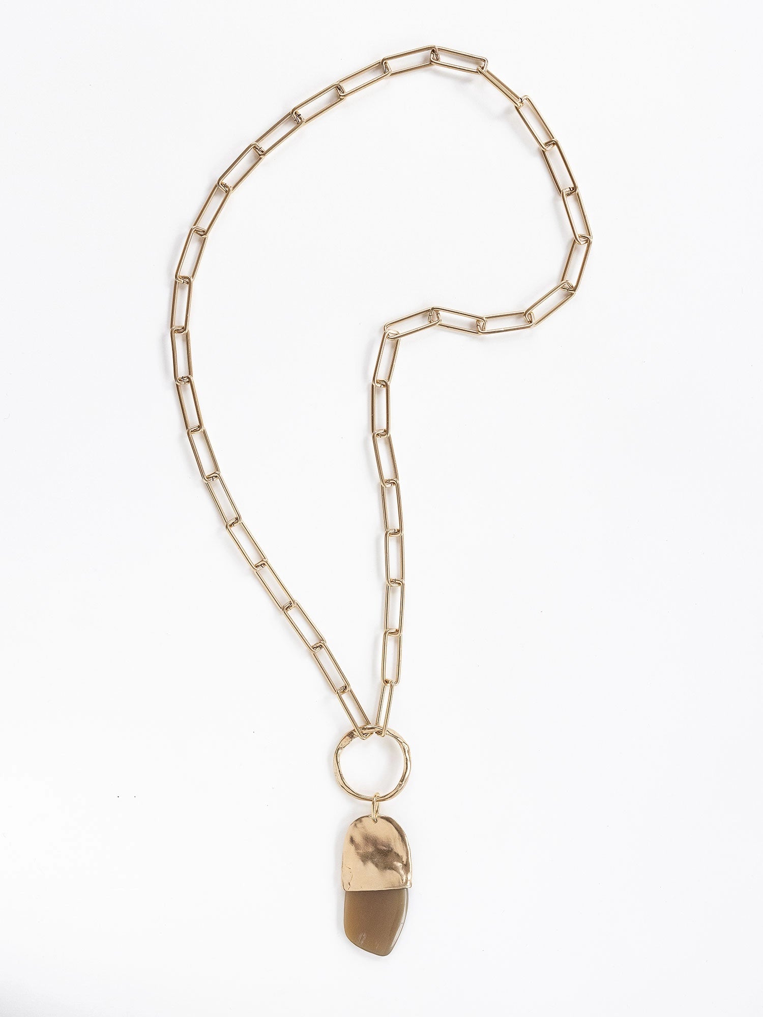 A brass chain necklace with a camel horn pendant by Michelle Ross