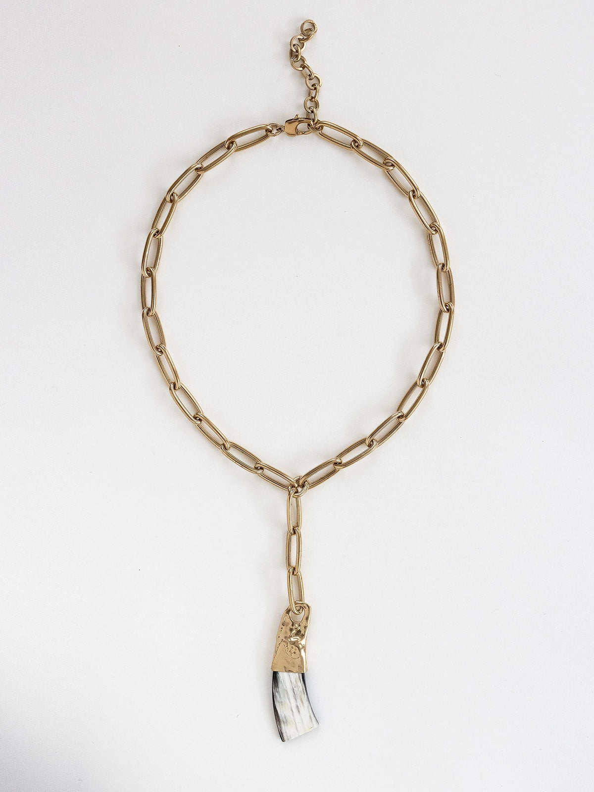 Brass chain link lariat necklace with a large horn pendant by Michelle Ross