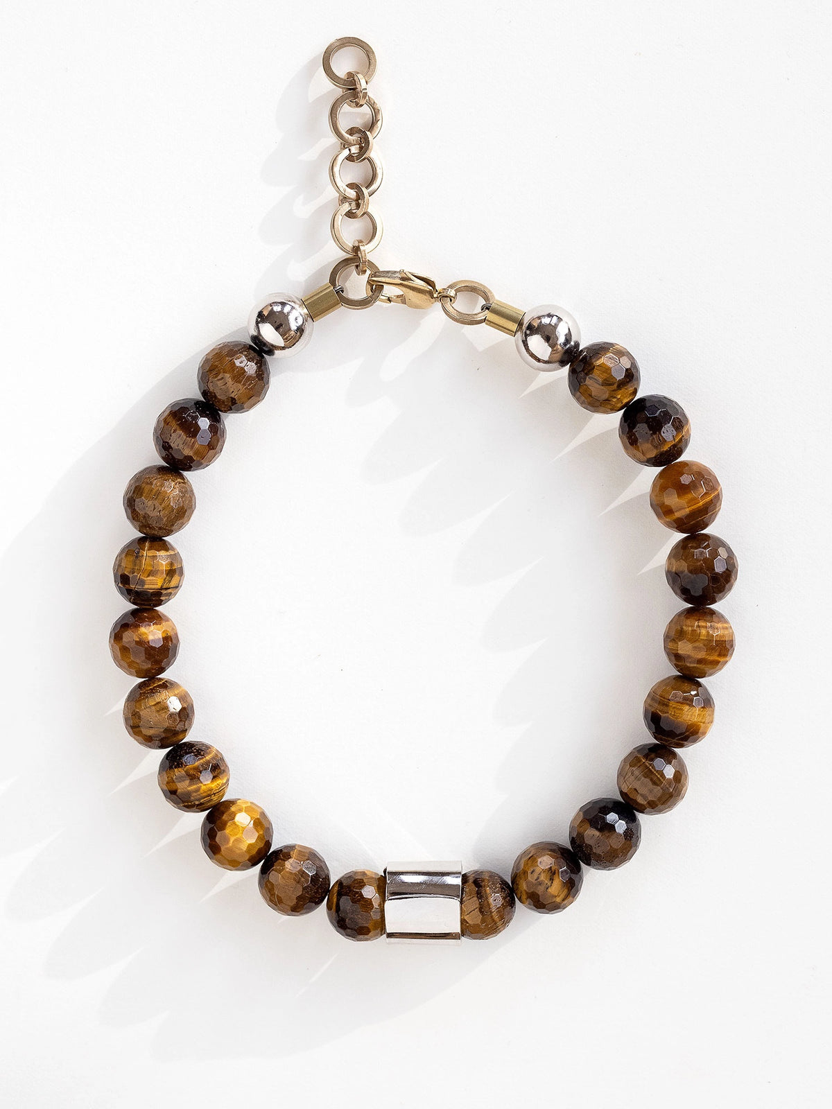 A beaded necklace with tiger eye beads and silver and brass details by Michelle Ross