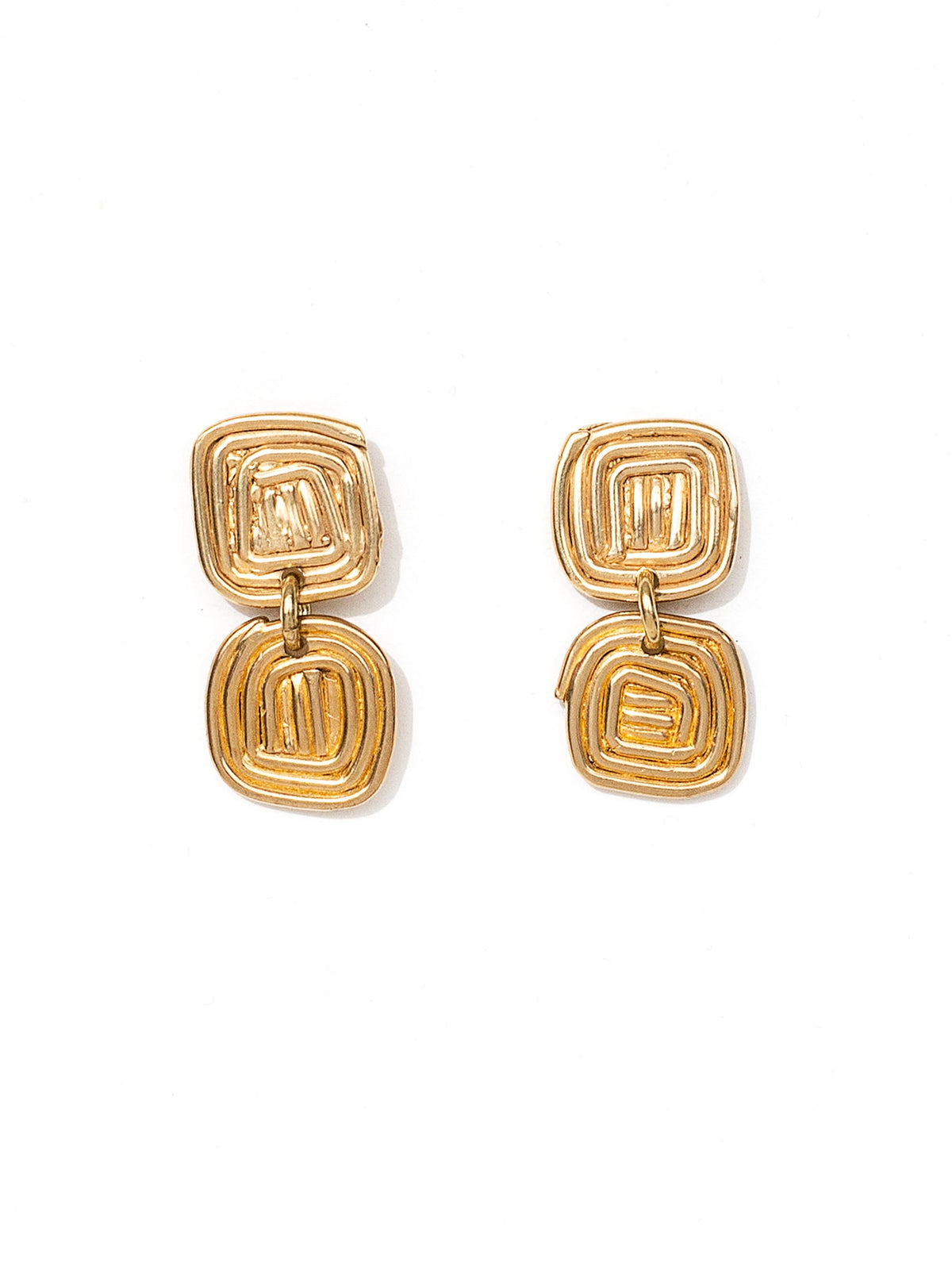 A pair of brass spiral drop earrings by contemporary designer Michelle Ross